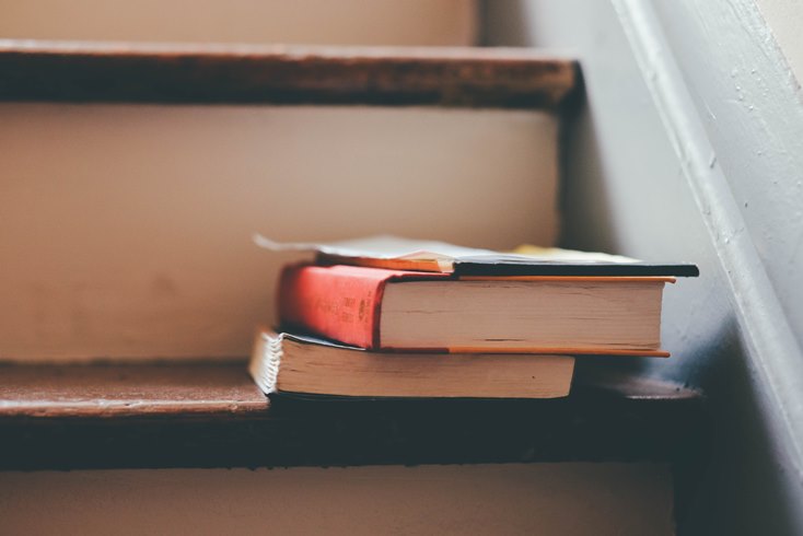 books stacked on a staircase