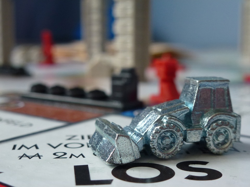 a blown up image of a monopoly piece on a monopoly board.