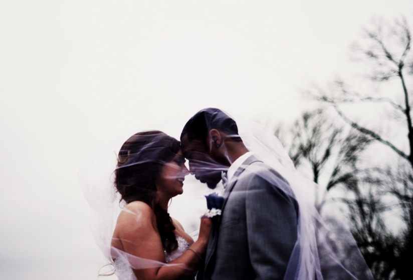 A couple embracing on their wedding day.