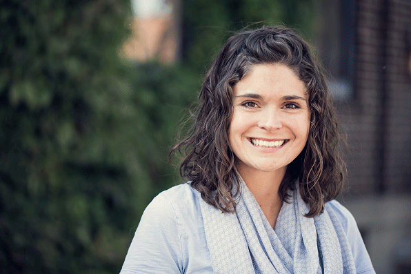 A young woman smiling at the camera.