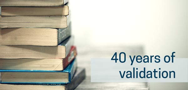 A image of stacked books with the text "40 Years of Validation" on the image.