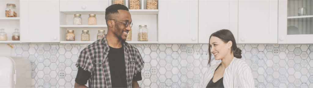 Man and Woman Having Conversation in the Kitchen