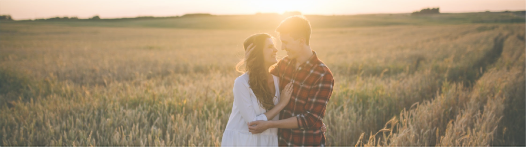 A Couple Standing in the Farm Field