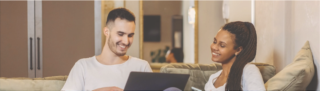 Man and Woman Sitting on Green Sofa discussing money