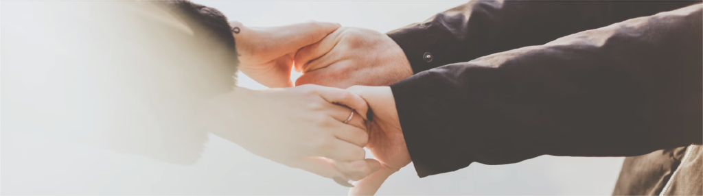 Couple holding hands in love